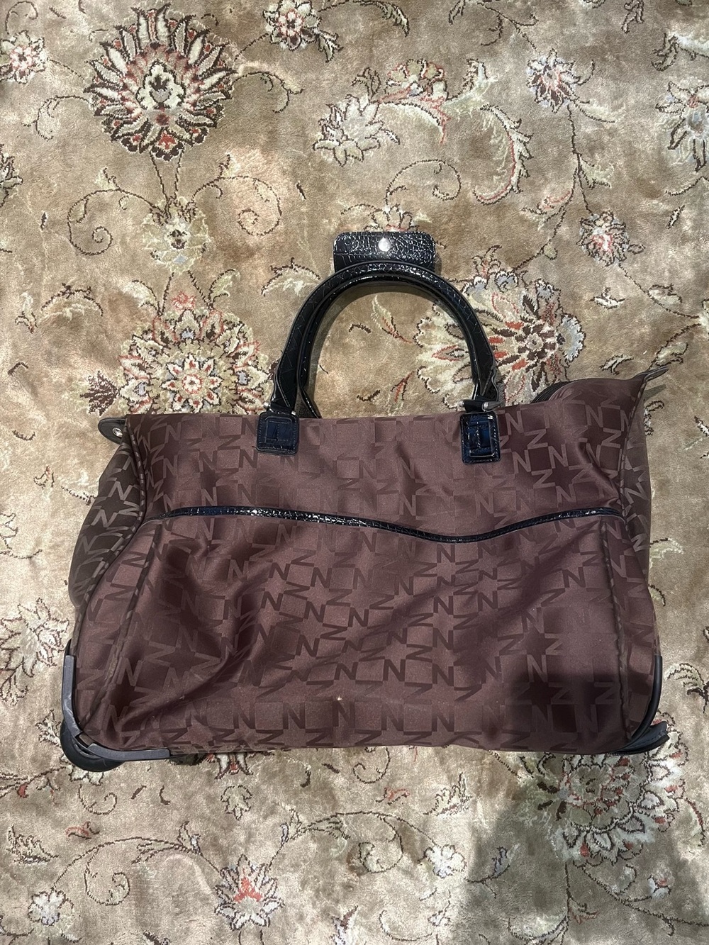 Chocolate brown roll on duffel bag with Black Trim